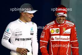 Valtteri Bottas (FIN) Mercedes AMG F1 and Sebastian Vettel (GER) Scuderia Ferrari  15.04.2017. Formula 1 World Championship, Rd 3, Bahrain Grand Prix, Sakhir, Bahrain, Qualifying Day.