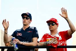 (L to R): Daniil Kvyat (RUS) Scuderia Toro Rosso with Kimi Raikkonen (FIN) Ferrari on the drivers parade. 16.04.2017. Formula 1 World Championship, Rd 3, Bahrain Grand Prix, Sakhir, Bahrain, Race Day.