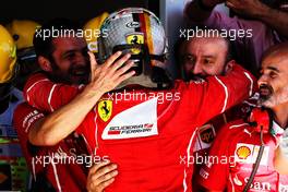 Race winner Sebastian Vettel (GER) Ferrari celebrates with the team in parc ferme. 12.11.2017. Formula 1 World Championship, Rd 19, Brazilian Grand Prix, Sao Paulo, Brazil, Race Day.
