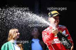 Race winner Sebastian Vettel (GER) Ferrari celebrates with the champagne on the podium. 12.11.2017. Formula 1 World Championship, Rd 19, Brazilian Grand Prix, Sao Paulo, Brazil, Race Day.