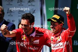 Race winner Sebastian Vettel (GER) Ferrari celebrates with Giuseppe Vietina (ITA) Ferrari on the podium. 12.11.2017. Formula 1 World Championship, Rd 19, Brazilian Grand Prix, Sao Paulo, Brazil, Race Day.