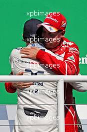 Race winner Sebastian Vettel (GER) Ferrari celebrates with Felipe Massa (BRA) Williams on the podium. 12.11.2017. Formula 1 World Championship, Rd 19, Brazilian Grand Prix, Sao Paulo, Brazil, Race Day.
