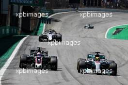 Lewis Hamilton (GBR) Mercedes AMG F1 W08 overtakes Romain Grosjean (FRA) Haas F1 Team VF-17. 12.11.2017. Formula 1 World Championship, Rd 19, Brazilian Grand Prix, Sao Paulo, Brazil, Race Day.