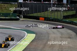 Romain Grosjean (FRA) Haas F1 Team VF-17 and Esteban Ocon (FRA) Sahara Force India F1 VJM10 spin off at the start of the race. 12.11.2017. Formula 1 World Championship, Rd 19, Brazilian Grand Prix, Sao Paulo, Brazil, Race Day.