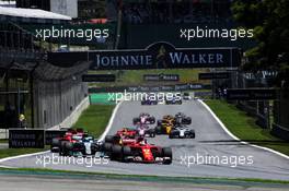 Sebastian Vettel (GER) Ferrari SF70H leads at the start of the race. 12.11.2017. Formula 1 World Championship, Rd 19, Brazilian Grand Prix, Sao Paulo, Brazil, Race Day.