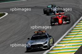 Sebastian Vettel (GER) Ferrari SF70H leads behind the FIA Safety Car. 12.11.2017. Formula 1 World Championship, Rd 19, Brazilian Grand Prix, Sao Paulo, Brazil, Race Day.