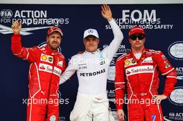 Qualifying top three in parc ferme (L to R): Sebastian Vettel (GER) Ferrari, second; Valtteri Bottas (FIN) Mercedes AMG F1, pole position; Kimi Raikkonen (FIN) Ferrari, third. 11.11.2017. Formula 1 World Championship, Rd 19, Brazilian Grand Prix, Sao Paulo, Brazil, Qualifying Day.