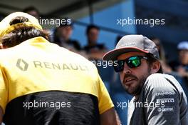 (L to R): Carlos Sainz Jr (ESP) Renault Sport F1 Team with Fernando Alonso (ESP) McLaren on the drivers parade. 12.11.2017. Formula 1 World Championship, Rd 19, Brazilian Grand Prix, Sao Paulo, Brazil, Race Day.