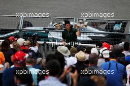 Lewis Hamilton (GBR) Mercedes AMG F1 W08 passes a Heineken vendor. 09.06.2017. Formula 1 World Championship, Rd 7, Canadian Grand Prix, Montreal, Canada, Practice Day.