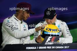 (L to R): Lewis Hamilton (GBR) Mercedes AMG F1 with the helmet of Ayrton Senna, presented to him after equalling the number of pole positions set by the Brazilian, and Valtteri Bottas (FIN) Mercedes AMG F1. 10.06.2017. Formula 1 World Championship, Rd 7, Canadian Grand Prix, Montreal, Canada, Qualifying Day.