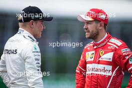 (L to R): Valtteri Bottas (FIN) Mercedes AMG F1 with Sebastian Vettel (GER) Ferrari. 10.06.2017. Formula 1 World Championship, Rd 7, Canadian Grand Prix, Montreal, Canada, Qualifying Day.