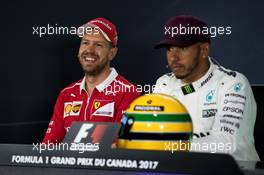 (L to R): Sebastian Vettel (GER) Ferrari with Lewis Hamilton (GBR) Mercedes AMG F1 in the FIA Press Conference. 10.06.2017. Formula 1 World Championship, Rd 7, Canadian Grand Prix, Montreal, Canada, Qualifying Day.