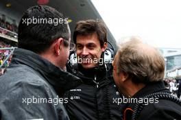 (L to R): Eric Boullier (FRA) McLaren Racing Director with Toto Wolff (GER) Mercedes AMG F1 Shareholder and Executive Director and Robert Fernley (GBR) Sahara Force India F1 Team Deputy Team Principal on the grid. 09.04.2017. Formula 1 World Championship, Rd 2, Chinese Grand Prix, Shanghai, China, Race Day.