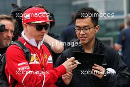 Kimi Raikkonen (FIN) Ferrari signs autographs for the fans. 06.04.2017. Formula 1 World Championship, Rd 2, Chinese Grand Prix, Shanghai, China, Preparation Day.