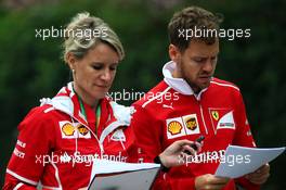 Sebastian Vettel (GER) Ferrari with Britta Roeske (AUT) Ferrari Press Officer. 06.04.2017. Formula 1 World Championship, Rd 2, Chinese Grand Prix, Shanghai, China, Preparation Day.