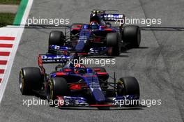 Daniil Kvyat (RUS) Scuderia Toro Rosso STR12 leads team mate Carlos Sainz Jr (ESP) Scuderia Toro Rosso STR12. 14.05.2017. Formula 1 World Championship, Rd 5, Spanish Grand Prix, Barcelona, Spain, Race Day.