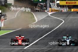 Valtteri Bottas (FIN) Mercedes AMG F1 W08 and Sebastian Vettel (GER) Ferrari SF70H battle for position. 14.05.2017. Formula 1 World Championship, Rd 5, Spanish Grand Prix, Barcelona, Spain, Race Day.