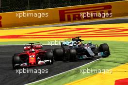 Sebastian Vettel (GER) Ferrari SF70H and Lewis Hamilton (GBR) Mercedes AMG F1 W08 battle for the lead of the race. 14.05.2017. Formula 1 World Championship, Rd 5, Spanish Grand Prix, Barcelona, Spain, Race Day.