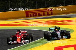 Sebastian Vettel (GER) Ferrari SF70H and Lewis Hamilton (GBR) Mercedes AMG F1 W08 battle for the lead of the race. 14.05.2017. Formula 1 World Championship, Rd 5, Spanish Grand Prix, Barcelona, Spain, Race Day.