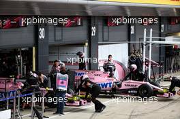 Esteban Ocon (FRA) Sahara Force India F1 VJM10 and Sergio Perez (MEX) Sahara Force India F1 VJM10 in the pits. 14.07.2017. Formula 1 World Championship, Rd 10, British Grand Prix, Silverstone, England, Practice Day.