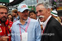 (L to R): Woody Harrelson (USA) Actor with Chase Carey (USA) Formula One Group Chairman on the grid. 16.07.2017. Formula 1 World Championship, Rd 10, British Grand Prix, Silverstone, England, Race Day.