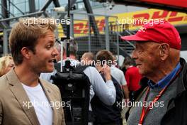 (L to R): Nico Rosberg (GER) with Niki Lauda (AUT) Mercedes Non-Executive Chairman on the grid. 16.07.2017. Formula 1 World Championship, Rd 10, British Grand Prix, Silverstone, England, Race Day.