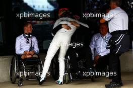 Race winner Lewis Hamilton (GBR) Mercedes AMG F1 celebrates in parc ferme, with Billy Monger (GBR) Racing Driver (Left). 16.07.2017. Formula 1 World Championship, Rd 10, British Grand Prix, Silverstone, England, Race Day.