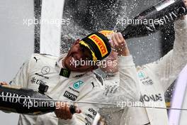 Race winner Lewis Hamilton (GBR) Mercedes AMG F1 celebrates on the podium with team mate Valtteri Bottas (FIN) Mercedes AMG F1. 16.07.2017. Formula 1 World Championship, Rd 10, British Grand Prix, Silverstone, England, Race Day.