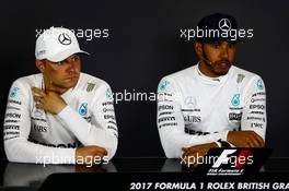 (L to R): Valtteri Bottas (FIN) Mercedes AMG F1 and Lewis Hamilton (GBR) Mercedes AMG F1 in the FIA Press Conference. 16.07.2017. Formula 1 World Championship, Rd 10, British Grand Prix, Silverstone, England, Race Day.