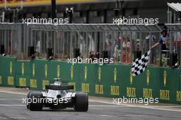 Race winner Lewis Hamilton (GBR) Mercedes AMG F1 W08 takes the chequered flag at the end of the race. 16.07.2017. Formula 1 World Championship, Rd 10, British Grand Prix, Silverstone, England, Race Day.