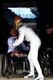Race winner Lewis Hamilton (GBR) Mercedes AMG F1 celebrates in parc ferme with Billy Monger (GBR) Racing Driver (Left). 16.07.2017. Formula 1 World Championship, Rd 10, British Grand Prix, Silverstone, England, Race Day.