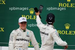 (L to R): Valtteri Bottas (FIN) Mercedes AMG F1 on the podium with team mate and race winner Lewis Hamilton (GBR) Mercedes AMG F1. 16.07.2017. Formula 1 World Championship, Rd 10, British Grand Prix, Silverstone, England, Race Day.