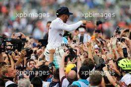 Race winner Lewis Hamilton (GBR) Mercedes AMG F1 crowd surfs with the fans. 16.07.2017. Formula 1 World Championship, Rd 10, British Grand Prix, Silverstone, England, Race Day.