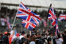 Lewis Hamilton (GBR) Mercedes AMG F1 fans invade the circuit at the end of the race. 16.07.2017. Formula 1 World Championship, Rd 10, British Grand Prix, Silverstone, England, Race Day.