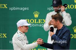 (L to R): Valtteri Bottas (FIN) Mercedes AMG F1 on the podium with Jenson Button (GBR) McLaren. 16.07.2017. Formula 1 World Championship, Rd 10, British Grand Prix, Silverstone, England, Race Day.
