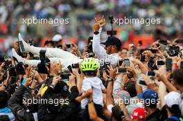 Race winner Lewis Hamilton (GBR) Mercedes AMG F1 crowd surfs with the fans. 16.07.2017. Formula 1 World Championship, Rd 10, British Grand Prix, Silverstone, England, Race Day.