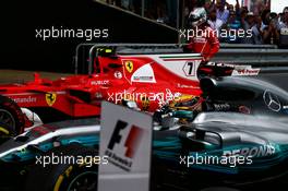 Sebastian Vettel (GER) Ferrari in parc ferme as race winner Lewis Hamilton (GBR) Mercedes AMG F1 W08 arrives. 16.07.2017. Formula 1 World Championship, Rd 10, British Grand Prix, Silverstone, England, Race Day.