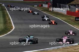Valtteri Bottas (FIN) Mercedes AMG F1 W08 and Esteban Ocon (FRA) Sahara Force India F1 VJM10 battle for position. 16.07.2017. Formula 1 World Championship, Rd 10, British Grand Prix, Silverstone, England, Race Day.