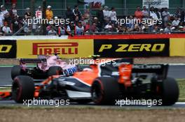 Esteban Ocon (FRA) Sahara Force India F1 VJM10 leads Stoffel Vandoorne (BEL) McLaren MCL32. 16.07.2017. Formula 1 World Championship, Rd 10, British Grand Prix, Silverstone, England, Race Day.