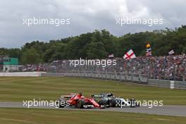 Sebastian Vettel (GER) Scuderia Ferrari and Valtteri Bottas (FIN) Mercedes AMG F1  16.07.2017. Formula 1 World Championship, Rd 10, British Grand Prix, Silverstone, England, Race Day.