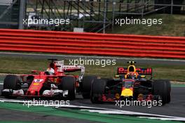 Max Verstappen (NLD) Red Bull Racing RB13 and Sebastian Vettel (GER) Ferrari SF70H battle for position. 16.07.2017. Formula 1 World Championship, Rd 10, British Grand Prix, Silverstone, England, Race Day.