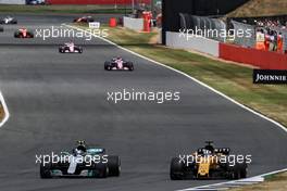 (L to R): Valtteri Bottas (FIN) Mercedes AMG F1 W08 and Nico Hulkenberg (GER) Renault Sport F1 Team RS17 battle for position. 16.07.2017. Formula 1 World Championship, Rd 10, British Grand Prix, Silverstone, England, Race Day.