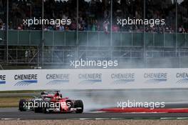 Sebastian Vettel (GER) Ferrari SF70H locks up under braking ahead of Valtteri Bottas (FIN) Mercedes AMG F1 W08. 16.07.2017. Formula 1 World Championship, Rd 10, British Grand Prix, Silverstone, England, Race Day.