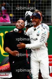 Lewis Hamilton (GBR) Mercedes AMG F1 celebrates his pole position with brother Nicolas Hamilton (GBR). 15.07.2017. Formula 1 World Championship, Rd 10, British Grand Prix, Silverstone, England, Qualifying Day.