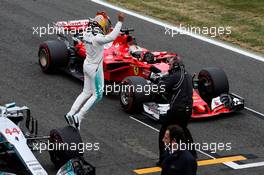 Lewis Hamilton (GBR) Mercedes AMG F1 W08 celebrates his pole position in front of Sebastian Vettel (GER) Ferrari SF70H. 15.07.2017. Formula 1 World Championship, Rd 10, British Grand Prix, Silverstone, England, Qualifying Day.