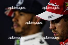 Sebastian Vettel (GER) Ferrari and Lewis Hamilton (GBR) Mercedes AMG F1 in the post qualifying FIA Press Conference. 15.07.2017. Formula 1 World Championship, Rd 10, British Grand Prix, Silverstone, England, Qualifying Day.