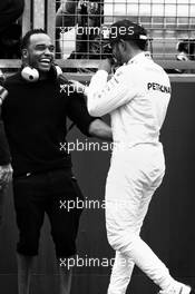 Lewis Hamilton (GBR) Mercedes AMG F1 celebrates his pole position with brother Nicolas Hamilton (GBR). 15.07.2017. Formula 1 World Championship, Rd 10, British Grand Prix, Silverstone, England, Qualifying Day.