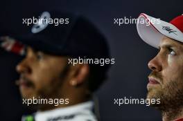 Sebastian Vettel (GER) Ferrari and Lewis Hamilton (GBR) Mercedes AMG F1 in the post qualifying FIA Press Conference. 15.07.2017. Formula 1 World Championship, Rd 10, British Grand Prix, Silverstone, England, Qualifying Day.