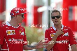 Kimi Raikkonen (FIN) Scuderia Ferrari and Sebastian Vettel (GER) Scuderia Ferrari  28.07.2017. Formula 1 World Championship, Rd 11, Hungarian Grand Prix, Budapest, Hungary, Practice Day.
