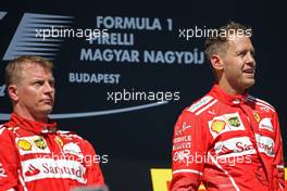 Sebastian Vettel (GER) Scuderia Ferrari and Kimi Raikkonen (FIN) Scuderia Ferrari  30.07.2017. Formula 1 World Championship, Rd 11, Hungarian Grand Prix, Budapest, Hungary, Race Day.